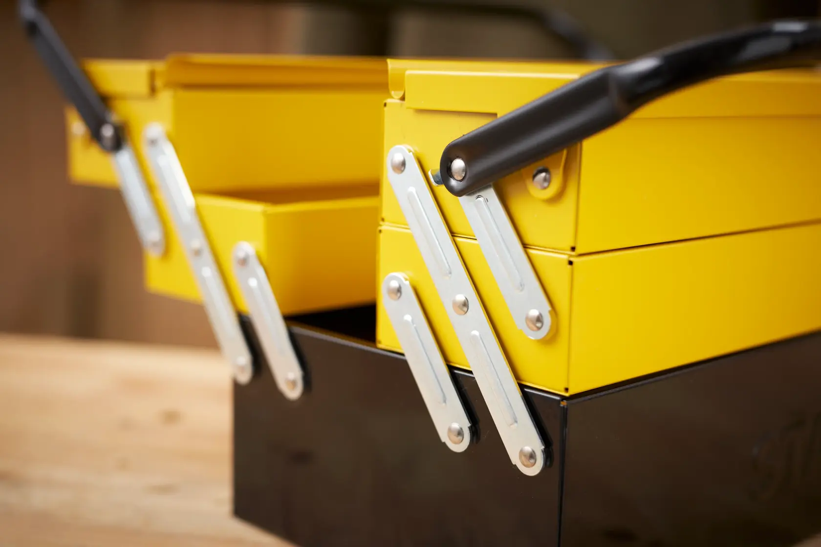 STANLEY 1-94-738 yellow and black metal toolbox, close-up side photography.