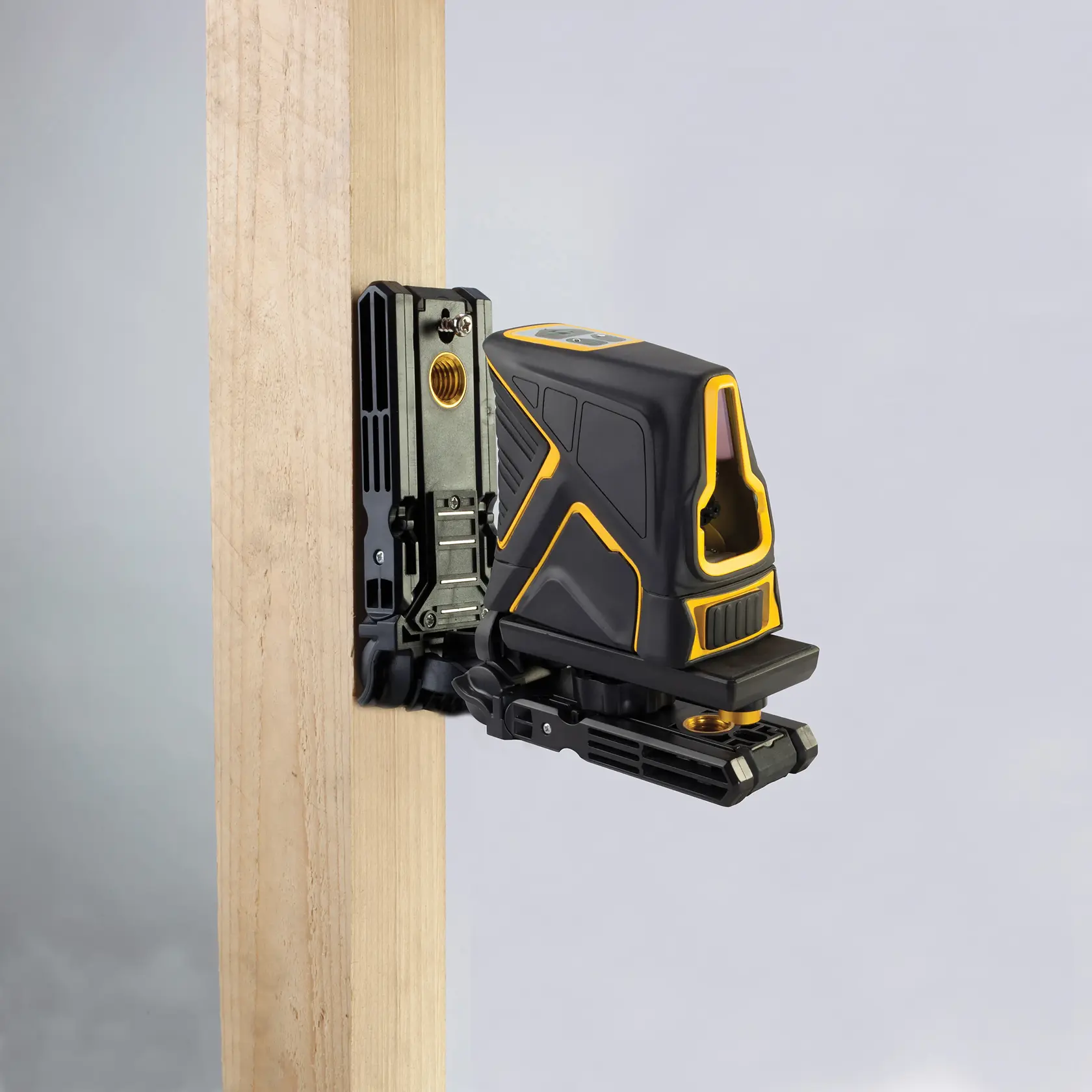 STANLEY FMHT1-77348 laser level device mounted on wood, side angle, black and yellow housing.