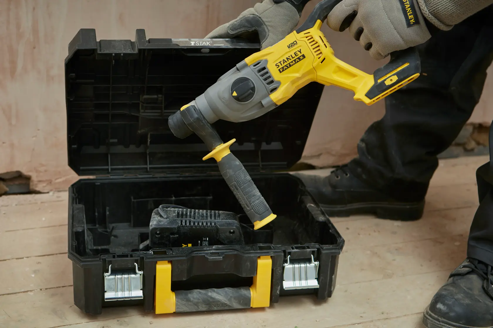 STANLEY SFMCH900M22 cordless rotary hammer drill in a black and yellow case, shown from a front angle.